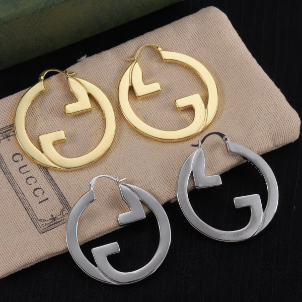 G*u*i earrings